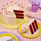 Classic Red Velvet Cake by Crumbs & Doilies with three moist red velvet layers and cream cheese frosting.